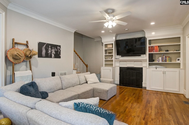 108 Shallow Brook Dr, Columbia, SC 29223 - living room with a ceiling fan, crown molding, a fireplace, wood finished floors, and recessed lighting