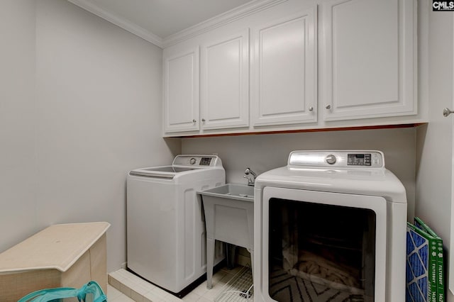 108 Shallow Brook Dr, Columbia, SC 29223 - laundry room featuring washer and dryer, ornamental molding, light tile patterned floors, and cabinet space