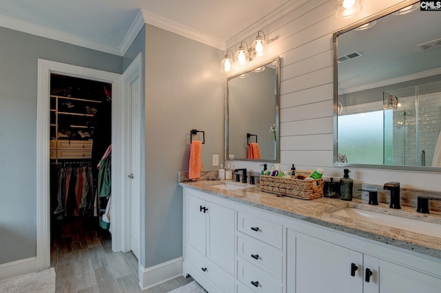 108 Shallow Brook Dr, Columbia, SC 29223 - bathroom featuring double vanity, a shower stall, a spacious closet, wood finished floors, and ornamental molding
