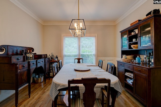 108 Shallow Brook Dr, Columbia, SC 29223 - dining area featuring a chandelier, light wood finished floors, crown molding, and wainscoting