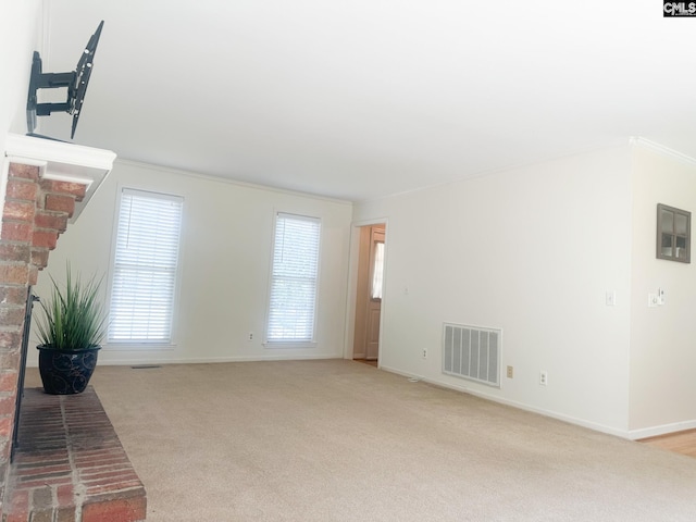 112 Valhalla Dr, Columbia, SC 29229 - unfurnished living room featuring light colored carpet, baseboards, crown molding, and a brick fireplace