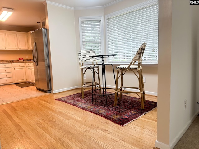 112 Valhalla Dr, Columbia, SC 29229 - dining space featuring ornamental molding, plenty of natural light, light wood-type flooring, and baseboards