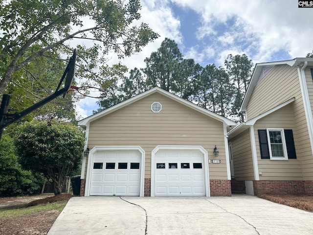112 Valhalla Dr, Columbia, SC 29229 - view of front facade with concrete driveway, an outbuilding, and brick siding