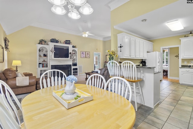 6 Hunting Glen Ct, Irmo, SC 29063 - dining area featuring crown molding, light tile patterned floors, ceiling fan, and a fireplace