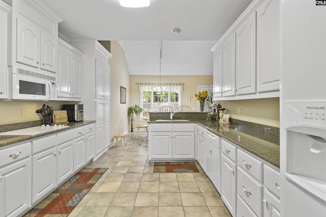 6 Hunting Glen Ct, Irmo, SC 29063 - kitchen featuring white appliances, white cabinets, a peninsula, a chandelier, and lofted ceiling