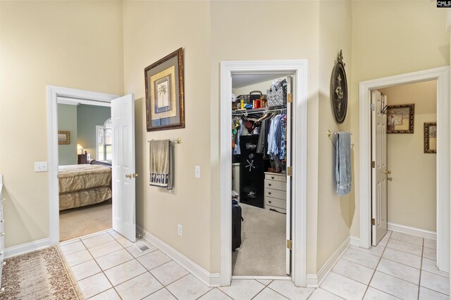 6 Hunting Glen Ct, Irmo, SC 29063 - hallway with light tile patterned floors, baseboards, and light carpet