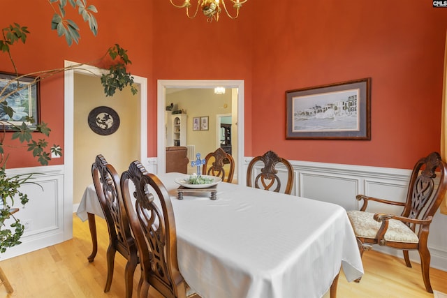 6 Hunting Glen Ct, Irmo, SC 29063 - dining room featuring a chandelier, wood finished floors, wainscoting, and a towering ceiling