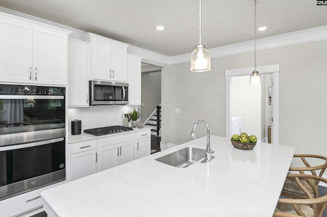2451 Thode Ln, Lexington, SC 29072 - kitchen with a sink, stainless steel appliances, a center island with sink, light countertops, and crown molding