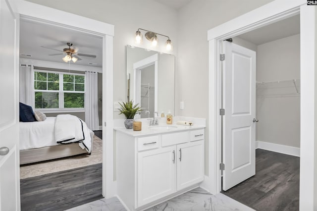 2451 Thode Ln, Lexington, SC 29072 - full bathroom featuring ceiling fan, vanity, ensuite bathroom, a walk in closet, and marble look tiles