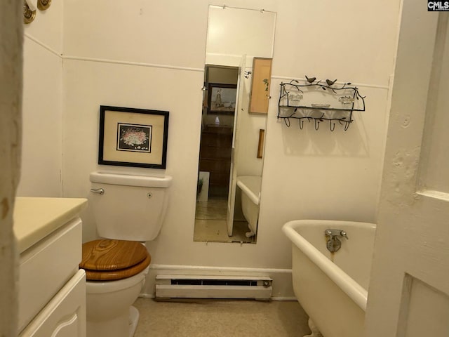 714 E Dunlap St, Lancaster, SC 29720 - bathroom with baseboard heating, a freestanding bath, toilet, and vanity
