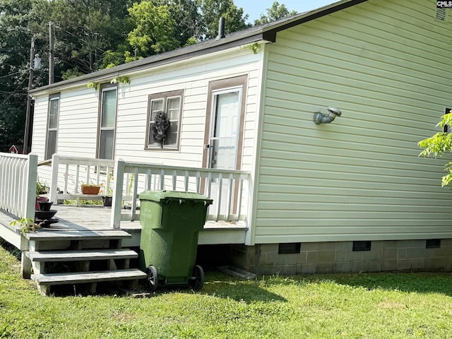 714 E Dunlap St, Lancaster, SC 29720 - back of property featuring crawl space, a wooden deck, and a lawn