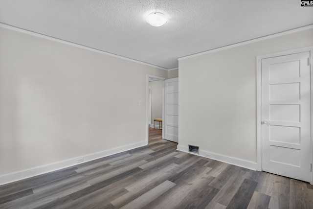 2611 Mills Dr, Columbia, SC 29204 - spare room with a textured ceiling, ornamental molding, wood finished floors, and baseboards