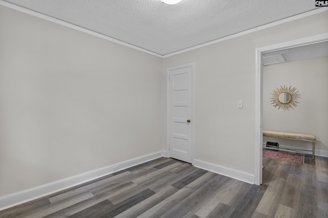 2611 Mills Dr, Columbia, SC 29204 - unfurnished room with a textured ceiling, dark wood finished floors, ornamental molding, and baseboards