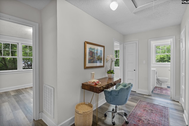 2611 Mills Dr, Columbia, SC 29204 - office featuring attic access, healthy amount of natural light, a textured ceiling, wood finished floors, and baseboards