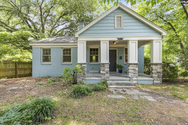 2611 Mills Dr, Columbia, SC 29204 - view of front of home featuring covered porch, brick siding, and a chimney