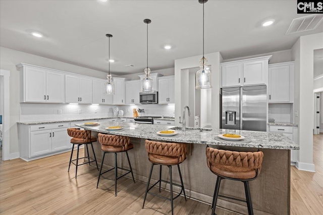 521 Fenwick Dr, Woodruff, SC 29388 - kitchen featuring stainless steel appliances, a sink, and white cabinetry