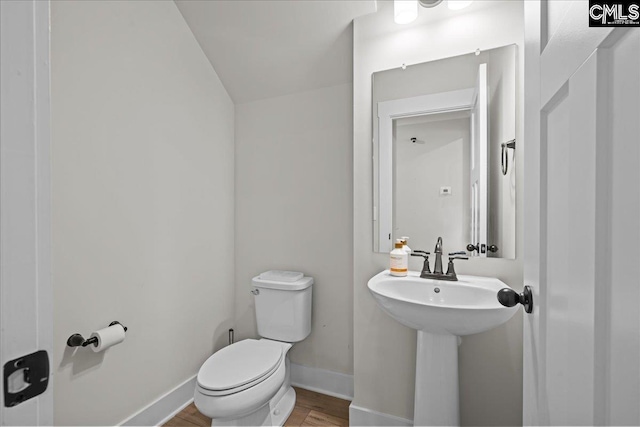 521 Fenwick Dr, Woodruff, SC 29388 - bathroom with toilet, wood finished floors, and baseboards