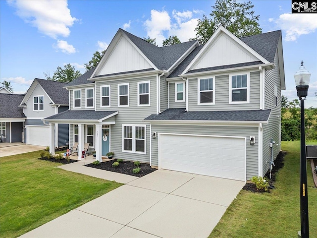 521 Fenwick Dr, Woodruff, SC 29388 - view of front facade with driveway, an attached garage, and board and batten siding