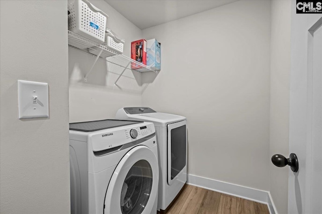521 Fenwick Dr, Woodruff, SC 29388 - laundry room with separate washer and dryer, wood finished floors, and baseboards