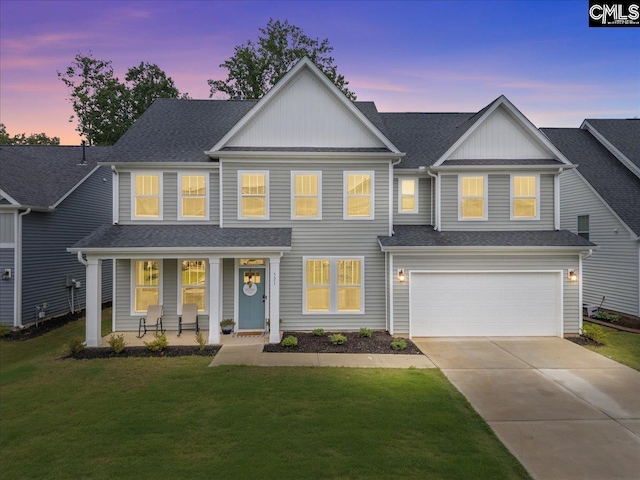 521 Fenwick Dr, Woodruff, SC 29388 - view of front facade with a porch, concrete driveway, a front yard, and an attached garage