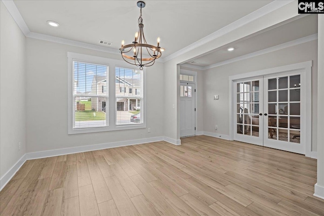 521 Fenwick Dr, Woodruff, SC 29388 - unfurnished dining area featuring ornamental molding, a chandelier, light wood-type flooring, baseboards, and french doors