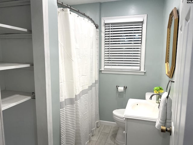 1432 Karlaney Ave, Cayce, SC 29033 - bathroom with toilet, vanity, baseboards, and a shower with shower curtain