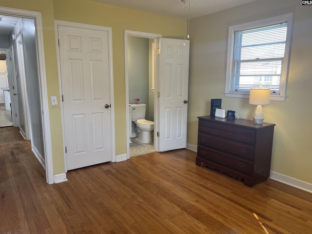 1432 Karlaney Ave, Cayce, SC 29033 - bedroom with baseboards, dark wood finished floors, and ensuite bath
