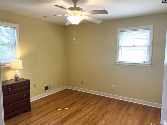 1432 Karlaney Ave, Cayce, SC 29033 - spare room with wood finished floors, baseboards, and ceiling fan