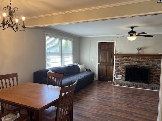 1432 Karlaney Ave, Cayce, SC 29033 - dining room featuring dark wood-style flooring, crown molding, ceiling fan, a chandelier, and a brick fireplace