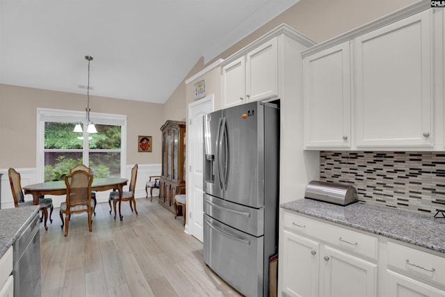 383 Summersweet Ct, Blythewood, SC 29016 - kitchen featuring stainless steel fridge, white cabinetry, light wood-style flooring, a wainscoted wall, and backsplash