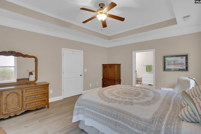 383 Summersweet Ct, Blythewood, SC 29016 - bedroom featuring a tray ceiling, light wood-style flooring, crown molding, ensuite bathroom, and baseboards