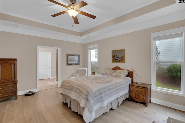 383 Summersweet Ct, Blythewood, SC 29016 - bedroom with baseboards, light wood finished floors, crown molding, and a raised ceiling