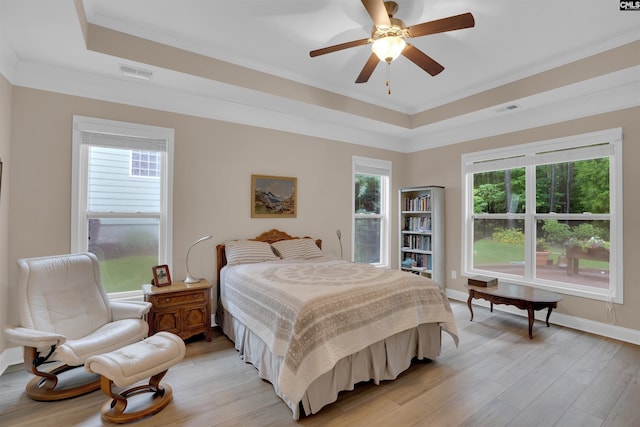 383 Summersweet Ct, Blythewood, SC 29016 - bedroom with a raised ceiling, light wood-style floors, baseboards, crown molding, and ceiling fan