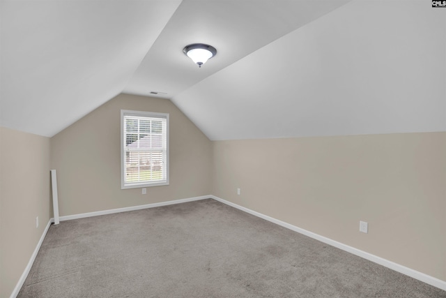 383 Summersweet Ct, Blythewood, SC 29016 - additional living space with carpet floors, vaulted ceiling, and baseboards