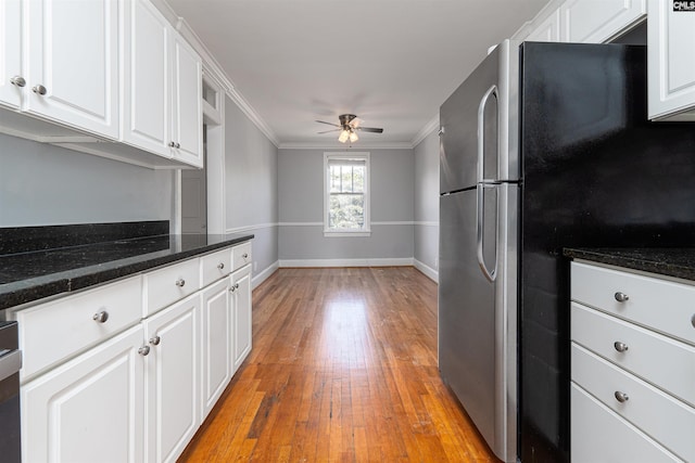 3407 River Dr Unit D, Columbia, SC 29201 - kitchen with freestanding refrigerator, ceiling fan, crown molding, white cabinets, and light wood-type flooring