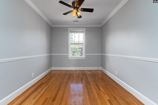 3407 River Dr Unit D, Columbia, SC 29201 - empty room featuring hardwood / wood-style floors, baseboards, a ceiling fan, and ornamental molding