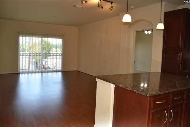 1085 Shop Rd Unit 226, Columbia, SC 29201 - kitchen with wood finished floors, ornamental molding, open floor plan, dark stone counters, and hanging light fixtures
