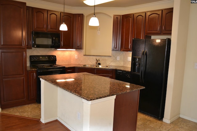 1085 Shop Rd Unit 226, Columbia, SC 29201 - kitchen featuring black appliances, a sink, decorative backsplash, dark stone countertops, and pendant lighting