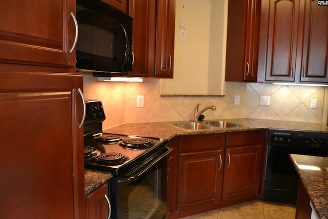 1085 Shop Rd Unit 226, Columbia, SC 29201 - kitchen with black appliances, a sink, decorative backsplash, dark stone countertops, and light tile patterned floors