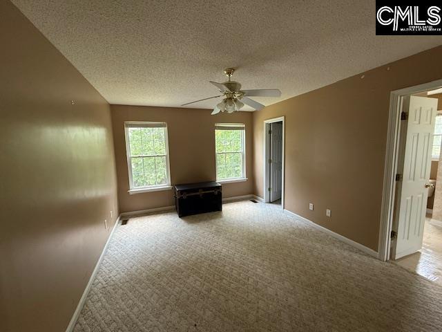 12 Beech Branch Ct, Irmo, SC 29063 - unfurnished room featuring baseboards, a ceiling fan, light carpet, and a textured ceiling