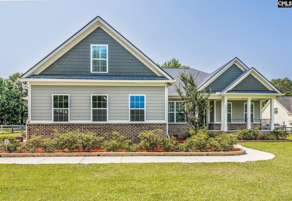 1225 Ridgeway, Lugoff, SC 29078 - craftsman-style home featuring brick siding, a front yard, and covered porch