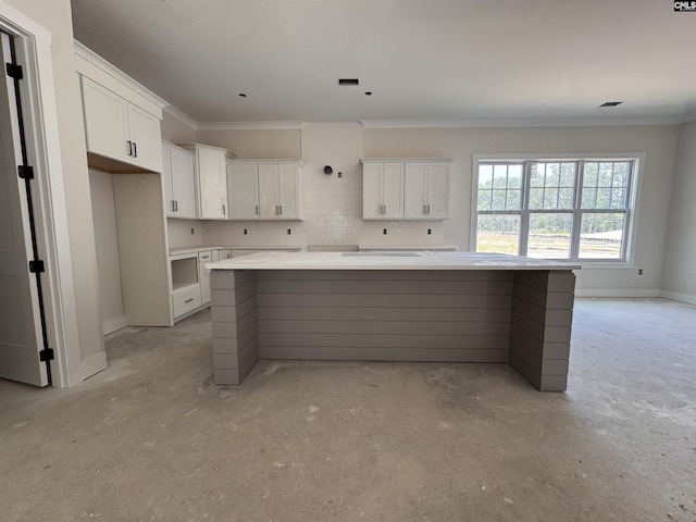 147 Harborside Cir, Columbia, SC 29229 - kitchen featuring ornamental molding, white cabinetry, a center island, concrete floors, and light countertops