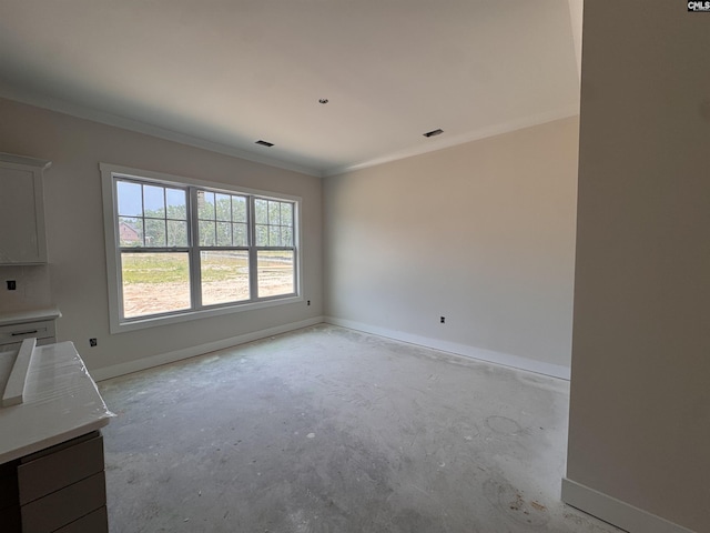 147 Harborside Cir, Columbia, SC 29229 - unfurnished dining area with unfinished concrete flooring, baseboards, and crown molding