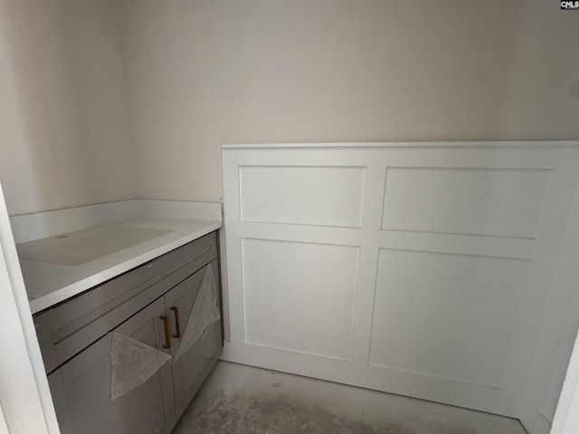 147 Harborside Cir, Columbia, SC 29229 - bathroom featuring concrete floors, vanity, and a decorative wall