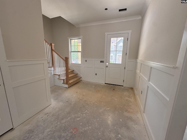 147 Harborside Cir, Columbia, SC 29229 - entryway featuring crown molding, a decorative wall, stairway, concrete flooring, and a wainscoted wall
