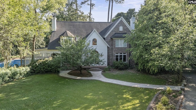 415 Pine St, Camden, SC 29020 - view of front of property with a chimney and a front lawn
