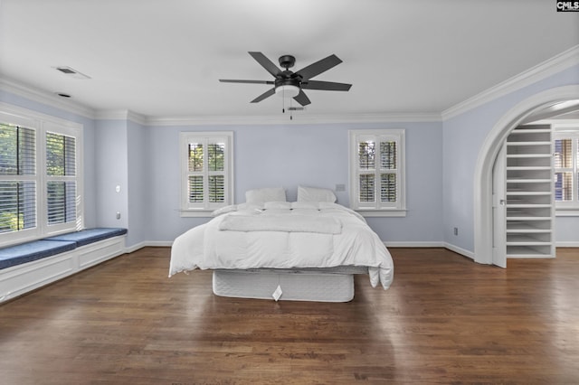415 Pine St, Camden, SC 29020 - bedroom featuring multiple windows, crown molding, baseboards, and wood finished floors
