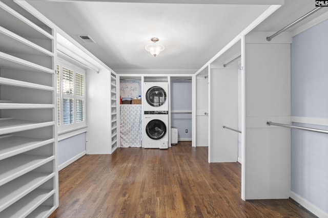 415 Pine St, Camden, SC 29020 - laundry area with estacked washer and dryer and wood finished floors