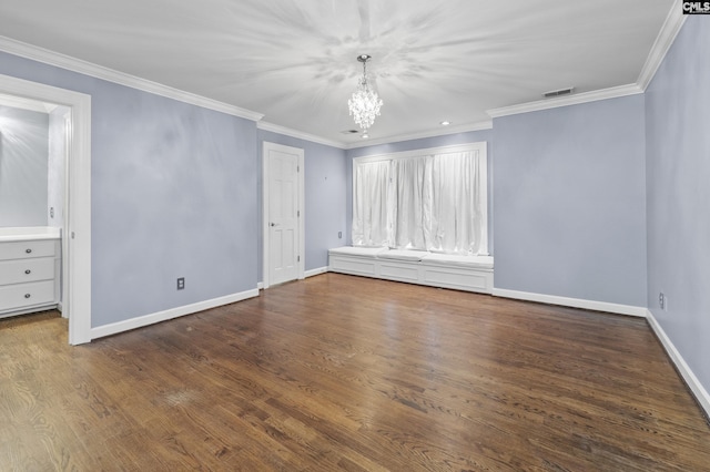 415 Pine St, Camden, SC 29020 - spare room featuring a chandelier, crown molding, baseboards, and wood finished floors