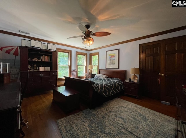 415 Pine St, Camden, SC 29020 - bedroom featuring dark wood-type flooring, ornamental molding, and ceiling fan